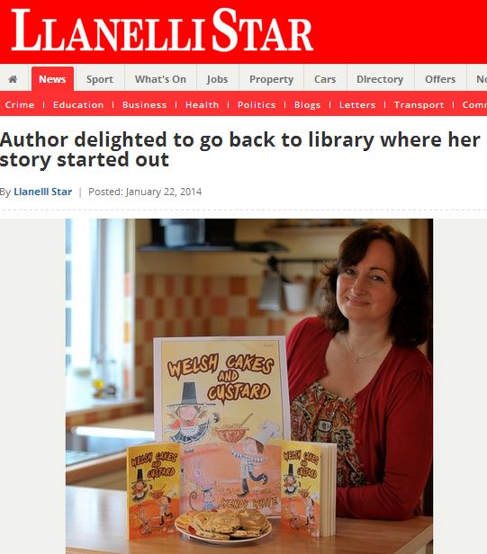 Wendy with poster and copies of Welsh Caked and Custard - picture taken from article in the Llanelli Star