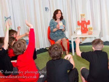 Wendy discussing reading with children in Cardiff Central Library